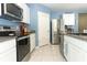 Modern kitchen with stainless steel appliances and granite countertops at 1186 August Sky Dr, Deltona, FL 32738