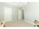 Simple bedroom with carpeted floors and two doors at 1186 August Sky Dr, Deltona, FL 32738