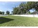 Large fenced backyard with green grass at 1186 August Sky Dr, Deltona, FL 32738