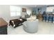 Spacious living room boasts ample natural light and comfortable seating at 1186 August Sky Dr, Deltona, FL 32738