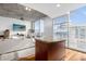 Modern kitchen with granite island and hardwood floors at 155 S Court Ave # 2208, Orlando, FL 32801