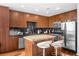 Well-equipped kitchen, featuring granite countertops and wooden cabinets at 155 S Court Ave # 2208, Orlando, FL 32801