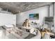 Open living area featuring a large TV and comfortable seating at 155 S Court Ave # 2208, Orlando, FL 32801
