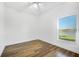 Bright bedroom with large window and wood-look flooring at 3404 Great Pond Dr, Kissimmee, FL 34746