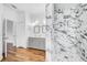 Spa-like bathroom featuring a large walk-in shower with marble tile and double vanity at 3404 Great Pond Dr, Kissimmee, FL 34746