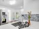 Modern kitchen with stainless steel appliances, white cabinets, and quartz countertops at 3404 Great Pond Dr, Kissimmee, FL 34746