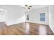 Large bedroom with wood-look floors and ceiling fan at 3404 Great Pond Dr, Kissimmee, FL 34746