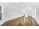 Spacious bedroom with wood-look floors and access to bathroom and closet at 3404 Great Pond Dr, Kissimmee, FL 34746