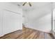 Well-lit bedroom with double door closet and wood-look flooring at 3404 Great Pond Dr, Kissimmee, FL 34746