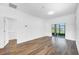 Bright Gathering room with wood-look floors and sliding glass doors leading to the backyard at 3404 Great Pond Dr, Kissimmee, FL 34746