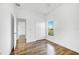 Bright bedroom with double door closet and wood-look flooring at 3404 Great Pond Dr, Kissimmee, FL 34746