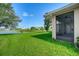 Landscaped backyard with pond view at 3404 Great Pond Dr, Kissimmee, FL 34746
