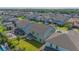 An aerial view of the house and backyard, showing a large green lawn and a pool at 14166 Dove Hollow Dr, Orlando, FL 32824