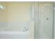 Clean bathroom with a bathtub and a separate shower stall at 14166 Dove Hollow Dr, Orlando, FL 32824