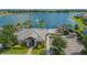 Resort-style pool, clubhouse, and lakefront views at 14166 Dove Hollow Dr, Orlando, FL 32824