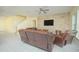 Living room with leather recliners and a stone accent wall, near staircase at 14166 Dove Hollow Dr, Orlando, FL 32824