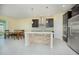 Modern kitchen with dark cabinets, stainless steel appliances, and an island at 14166 Dove Hollow Dr, Orlando, FL 32824
