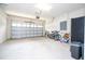 Garage with bikes, a refrigerator and plenty of storage space at 8841 Rhodes St, Kissimmee, FL 34747
