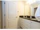 Bathroom with double vanity, granite countertop and mirror at 8841 Rhodes St, Kissimmee, FL 34747