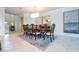 Elegant dining room with a large wooden table and chandelier at 8841 Rhodes St, Kissimmee, FL 34747