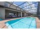 Inviting screened-in pool with brick pavers at 8841 Rhodes St, Kissimmee, FL 34747