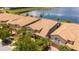 Aerial view of houses with terracotta roofs near a lake at 8841 Rhodes St, Kissimmee, FL 34747