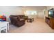 Finished basement recreation area with sectional sofa and TV at 8841 Rhodes St, Kissimmee, FL 34747