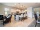 Bright kitchen featuring white cabinets and an island with seating at 8841 Rhodes St, Kissimmee, FL 34747