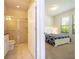 Bedroom with en-suite bathroom and ample natural light at 8841 Rhodes St, Kissimmee, FL 34747