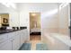 Bathroom with large soaking tub and double vanity at 8841 Rhodes St, Kissimmee, FL 34747