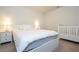 Bedroom with double bed, nightstands, and crib at 8841 Rhodes St, Kissimmee, FL 34747