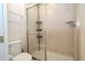 Bathroom with shower, toilet and tiled walls at 8841 Rhodes St, Kissimmee, FL 34747