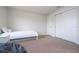 Bedroom with a twin bed, nightstand, and double door closet at 8841 Rhodes St, Kissimmee, FL 34747