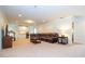 Finished basement with sectional sofa and entertainment center at 8841 Rhodes St, Kissimmee, FL 34747