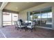 Covered patio with dining area and access to pool at 8841 Rhodes St, Kissimmee, FL 34747