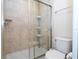 Clean bathroom with a shower and toilet at 8841 Rhodes St, Kissimmee, FL 34747