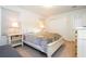 Light and airy bedroom with double bed, nightstands, and closet at 8841 Rhodes St, Kissimmee, FL 34747