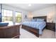 Spacious bedroom with king-size bed and large windows at 8841 Rhodes St, Kissimmee, FL 34747