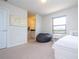 Bedroom with twin bed, beanbag chair, and en suite bathroom at 8841 Rhodes St, Kissimmee, FL 34747