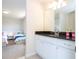 Clean bathroom with white cabinets and dark countertop at 8841 Rhodes St, Kissimmee, FL 34747