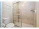 Simple bathroom with shower, toilet and tiled walls at 8841 Rhodes St, Kissimmee, FL 34747