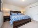 King-size bed, nightstands, and double doors leading to the bathroom at 8841 Rhodes St, Kissimmee, FL 34747