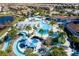 Resort-style pool with lazy river, water features, and expansive sundeck at 8841 Rhodes St, Kissimmee, FL 34747