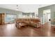 Spacious living room with large sectional sofa and wood floors at 24714 Martin St, Eustis, FL 32736