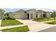 One-story home with attached garage and landscaping at 4278 Green Gables Pl, Kissimmee, FL 34746