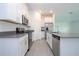 Modern kitchen with stainless steel appliances and white cabinets at 4278 Green Gables Pl, Kissimmee, FL 34746