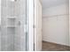 Bathroom with a walk-in shower and access to a spacious closet at 4278 Green Gables Pl, Kissimmee, FL 34746