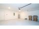 Spacious garage with automatic opener, water heater, and extra storage at 4278 Green Gables Pl, Kissimmee, FL 34746