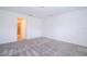 Large bedroom featuring gray carpeting and access to a bathroom and closet at 4278 Green Gables Pl, Kissimmee, FL 34746