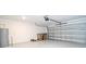 Garage with automatic opener, water heater, and storage space at 4278 Green Gables Pl, Kissimmee, FL 34746